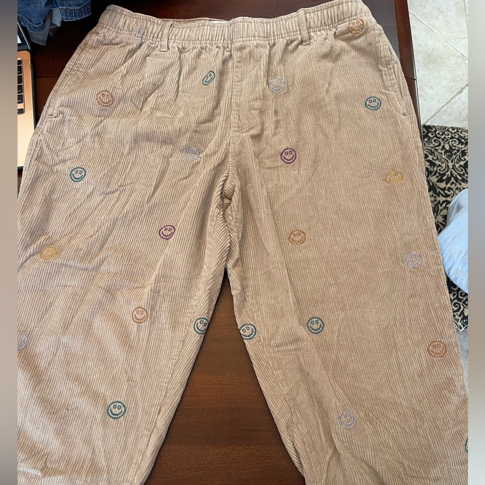 Smiley face corduroy pants